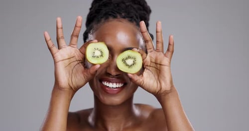 Woman with Kiwi Eye Mask Smiling