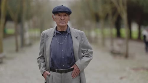 Elderly Gentleman Posing in Park