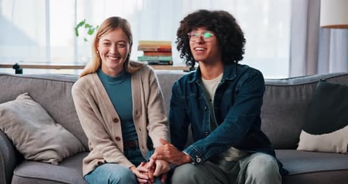 Happy, couple and holding hands for therapy, talking and laughing in office, smile and consultation