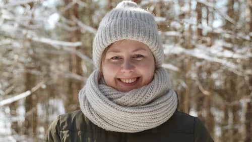 Headshot of Positive Smiling Woman Wearing Warm Accessories on Sunny Winter Day