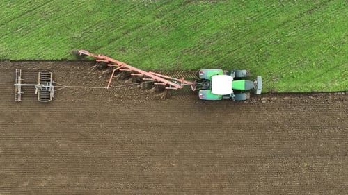 Aerial view of tractor ploughing in Brandenburg, Germany.