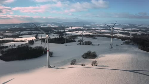 Panoramic View of Wind Turbines for Production of Green Energy in Winter Landscape