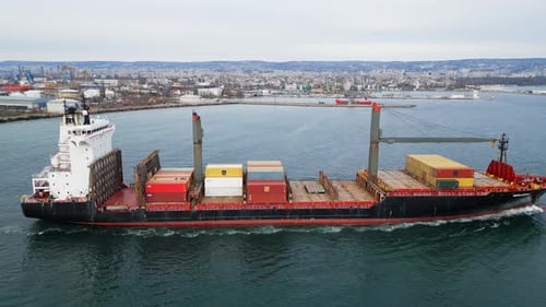 Aerial Closeup View of a Large Container Ship Navigating the Port of Varna Bulgaria Loaded with
