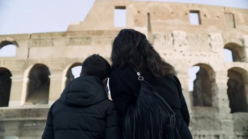 Woman and Child Visiting the Colosseum in Rome