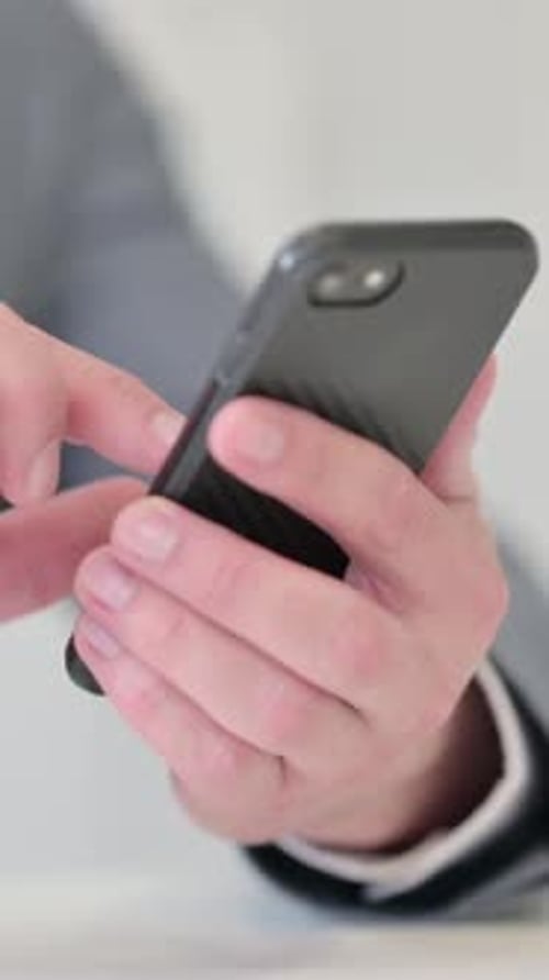 Vertical Video of Close up of Businessman using Smartphone, Mobile