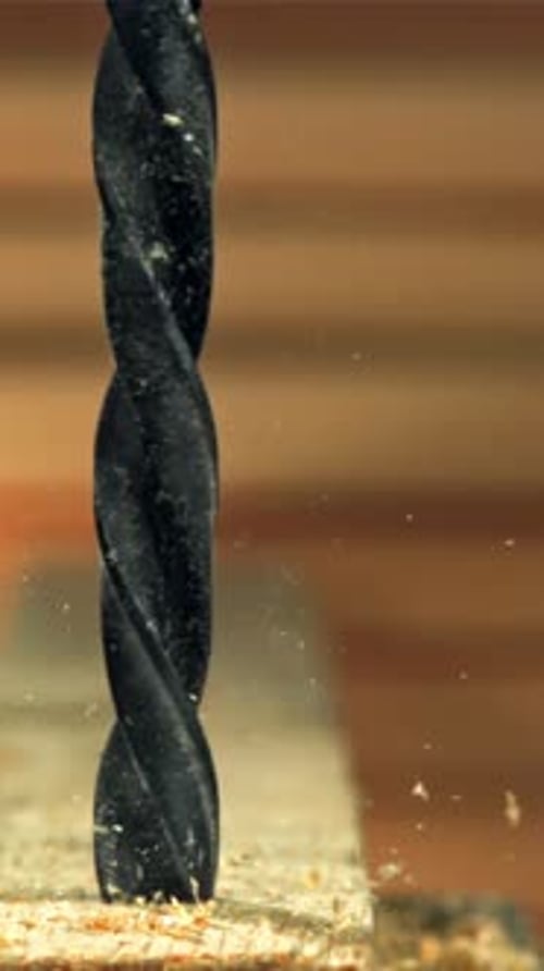 Drilling a Wooden Block in the Workshop Filmed on a Highspeed Camera at 1000 Fps