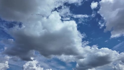 Clouds Floating in Blue Sky Aerial View