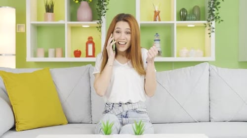 Happy Woman Talking on Phone in Living Room