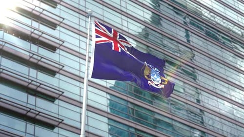 Falkland Islands Flag Waving in Front of Modern Glass Building
