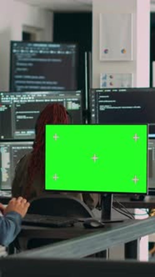 Adults Working with Green Screen in Modern Office