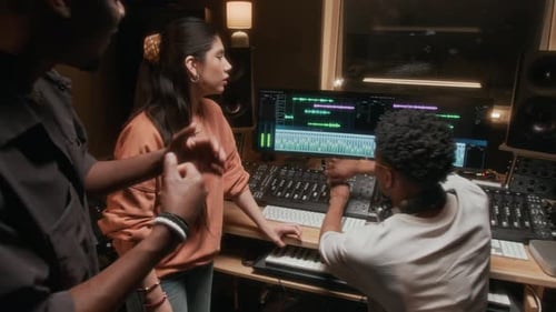 Zoom Out Musicians High Five in Recording Studio