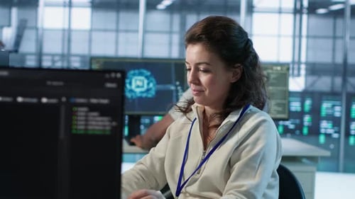 Joyful Technician Working in High Tech Data Center Workspace