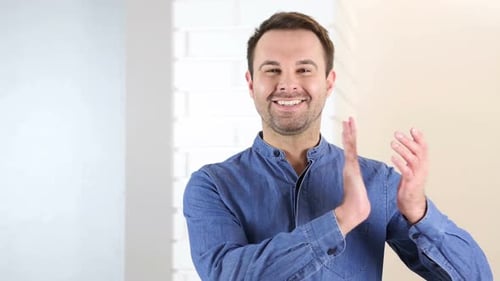 Adult Man Clapping Hands Indoors