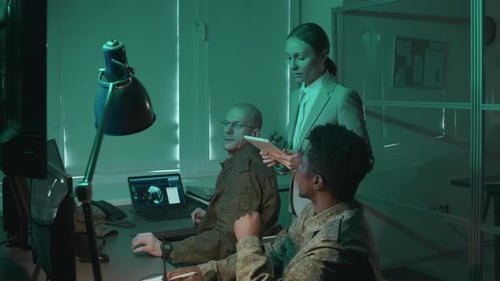 Workers Reviewing Data at a Computer Workstation