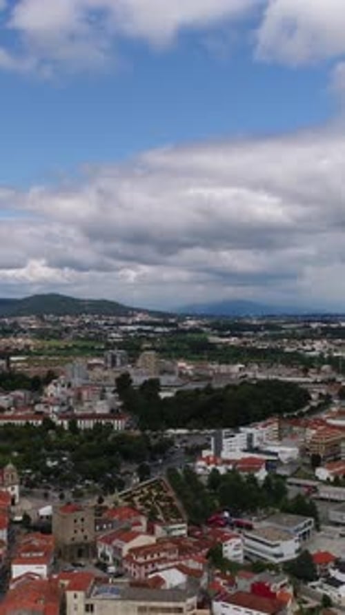 Vertical Video of City with Clouds in the Sky