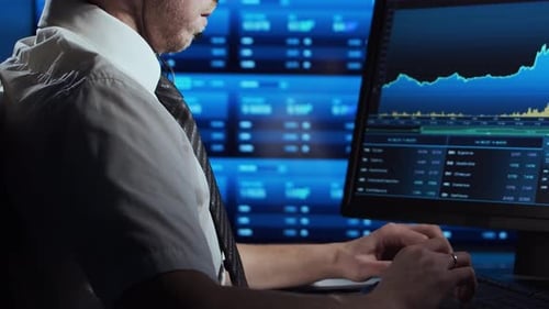 Trader Works in Office Using Workstation and Analysis Technology Workplace of Professional Crypto