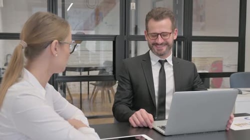 Business People Discussing Work in Office