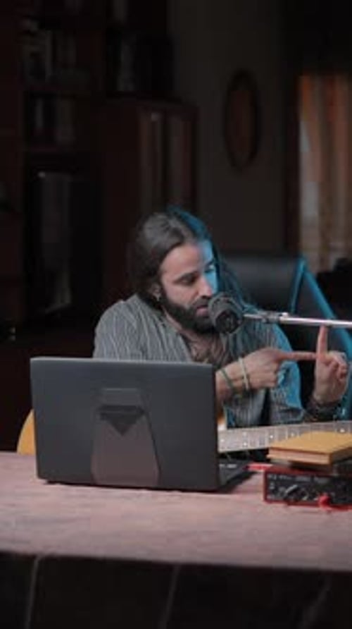 Musician Recording Guitar Music At Home At Night