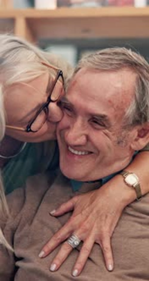 Senior Couple Embracing with Affection Indoors