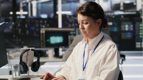 Data Center Software Developer Using PC to Monitor Neural Networks