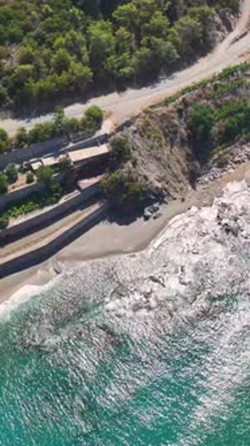 Vertical Video Elegant Villa on the Edge of a Cliff With Views of the Azure Sea and Surrounding