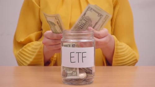 Person Saving Money for Investing in ETF