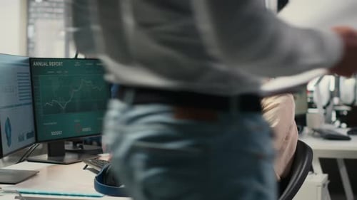 Female Executive Consultant Listening to Songs on Headphones at the Workstation