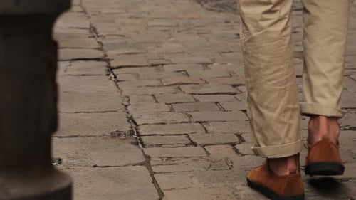 Legs with Boots of Walking Happy Tourist Man in Barcelona Spain Vacation Exploring Interesting