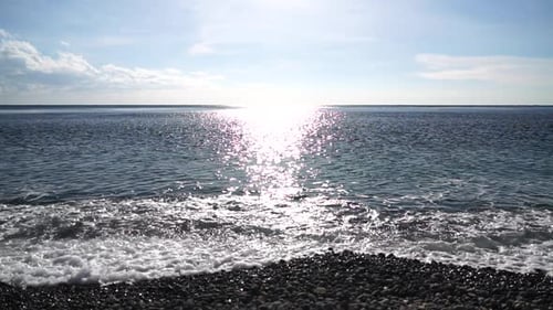 Abstract Shining Sun Reflections on Blue Surface of Sea Waves Bokeh Sun Glare Reflected in Water
