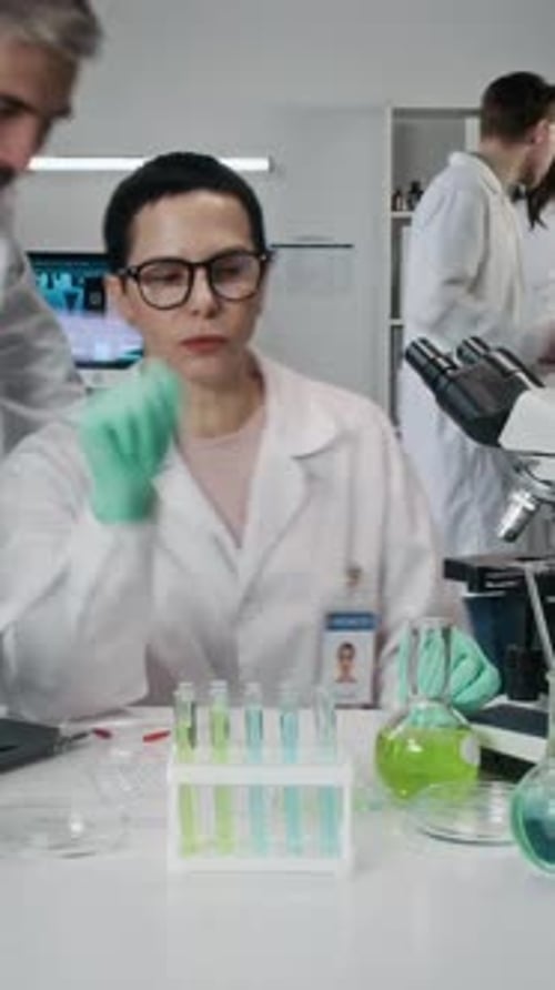 Scientists Conduct Research in Laboratory Setting