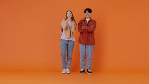 European Lady and Asian Guy Show Thumbs Up to Interlocutor