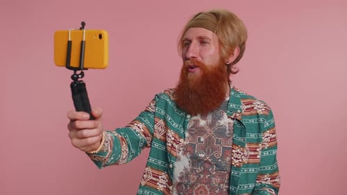 Adult Records Vlog with Smartphone on Tripod