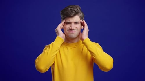 Man Experiencing Headache or Migraine