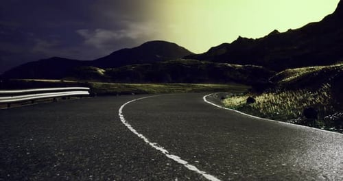 Winding Mountain Road Under a Starry Night Sky with Dramatic Lighting Effects