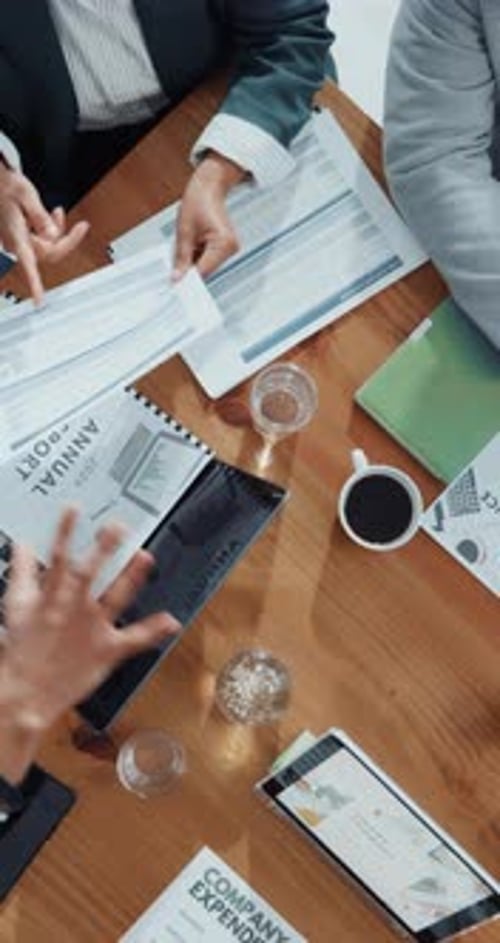 Hands, people and meeting with paperwork in office for accounting records of company expenditure