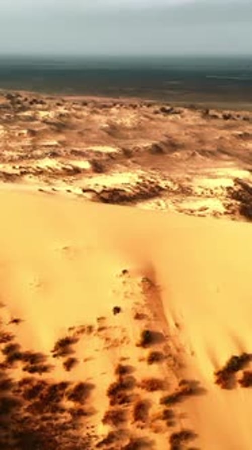 Expansive Sandy Dunes with Vegetation Impressive Aerial View of Sandy Dunes and Distant Coastlines