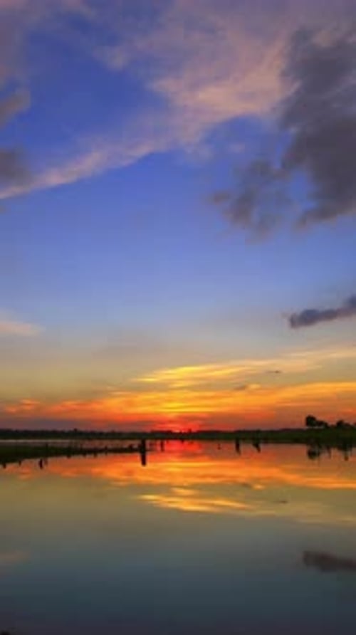 Picturesque Sunset Reflected in Serene Waters
