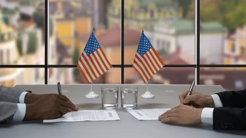 Business People Signing Contract with American Flags