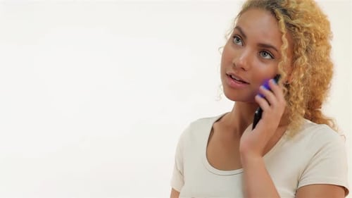 Woman Answering Cellphone Call and Smiling