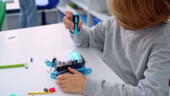 Robotics Programming Class Child Construct Mbot Screwdriver and Code ...
