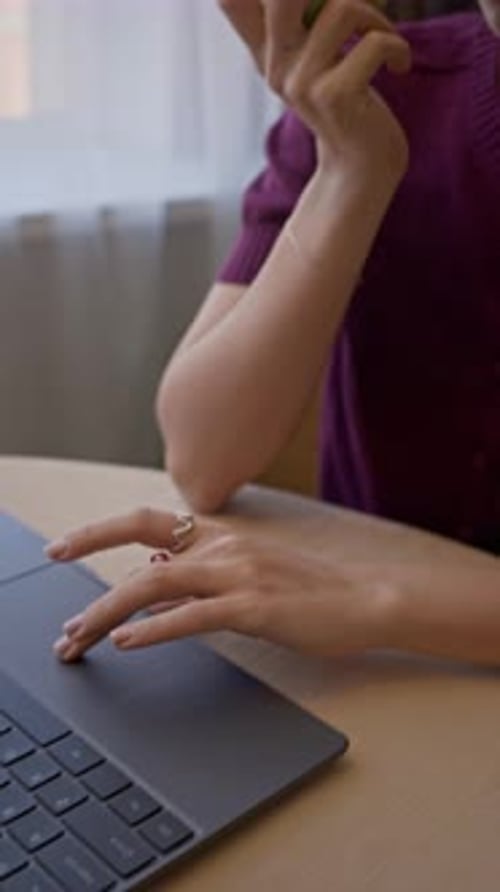Young Female Freelancer Eating Green Apple while Working on from Home
