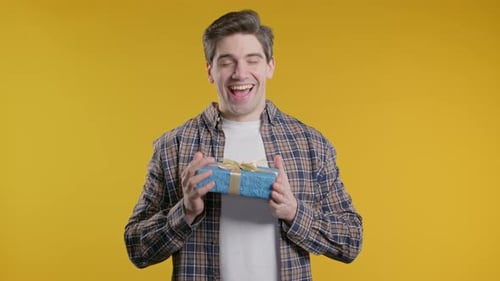 Happy Stylish Casual Man Gift Box Yellow Background Guy Smilingwhat's Inside