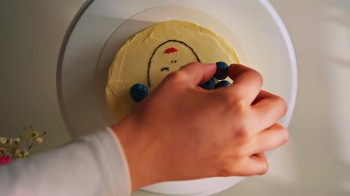 delicious freshly made sponge cake bento decorated with blueberries cake on a stand on a white