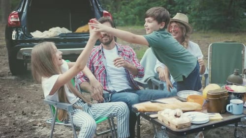 Family Camping Trip Having Fun in the Woods