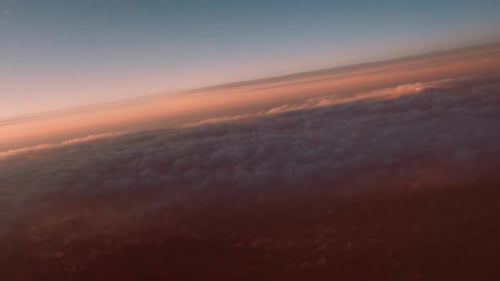 Aerial View of Golden Clouds at Sunrise