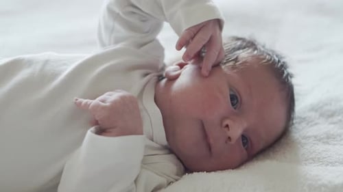 Close Up of Cute Infant Lying Down