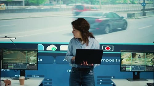 Young Manager Analyzing Traffic Surveillance Data with Her Employees Team