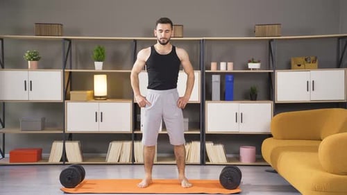Adult Male Warming Up Shoulders on Yoga Mat