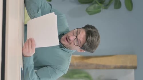 Man Reacts Angrily to News on Paper