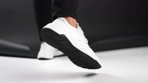 White modern stylish sneakers demonstration.